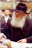 The Rebbe distributes "cup of blessing," wine that the Rebbe made an after-blessing on at the conclusion of a Chassidic gathering